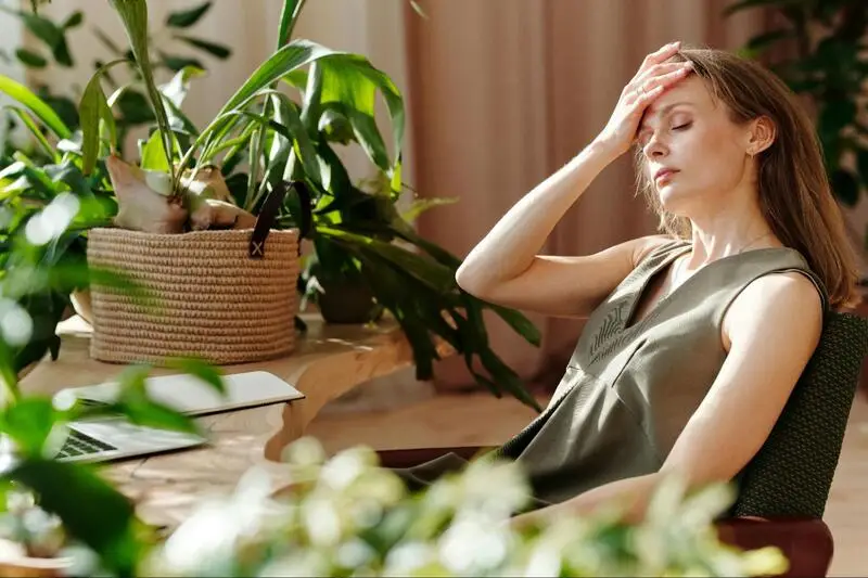 Woman having a fever as a result of opioids